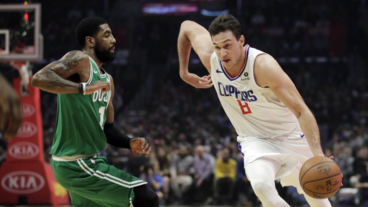 The Clippers' Danilo Gallinari drives the ball past the Boston Celtics' Kyrie Irving during the first half on March 11, 2019, in Los Angeles.