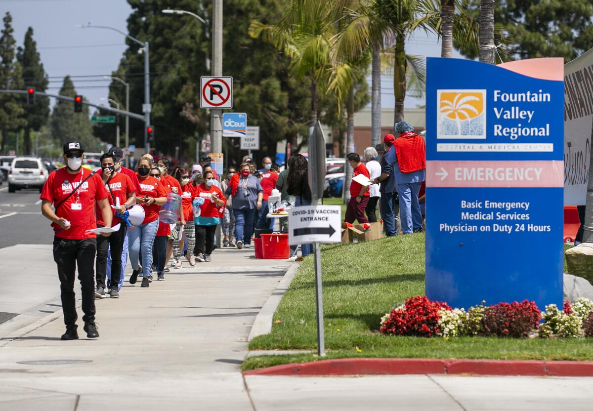 Fountain Valley Regional Hospital & Medical Center workers hold a rally outside the hospital on May 6.