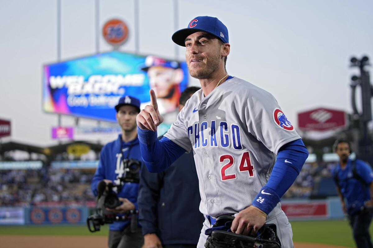 Chicago Cubs center fielder and former Dodger Cody Bellinger gestures to the crowd before Friday's game.