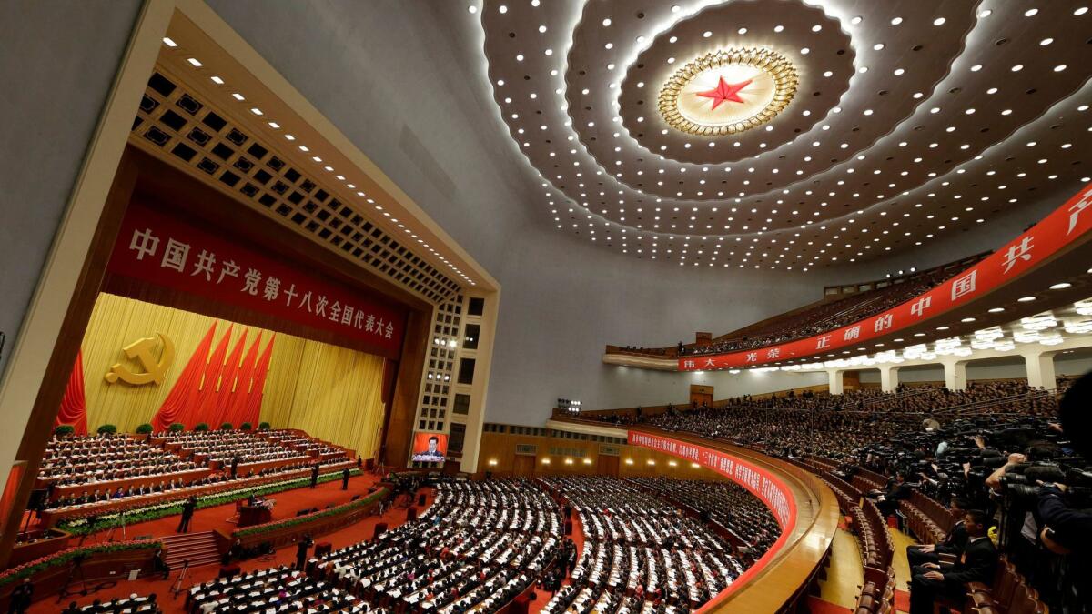 A 2012 file photo showing then-Chinese President Hu Jintao, center on the stage, at the 18th Communist Party congress held at the Great Hall of the People in Beijing. (Lee Jin-man / Associated Press)