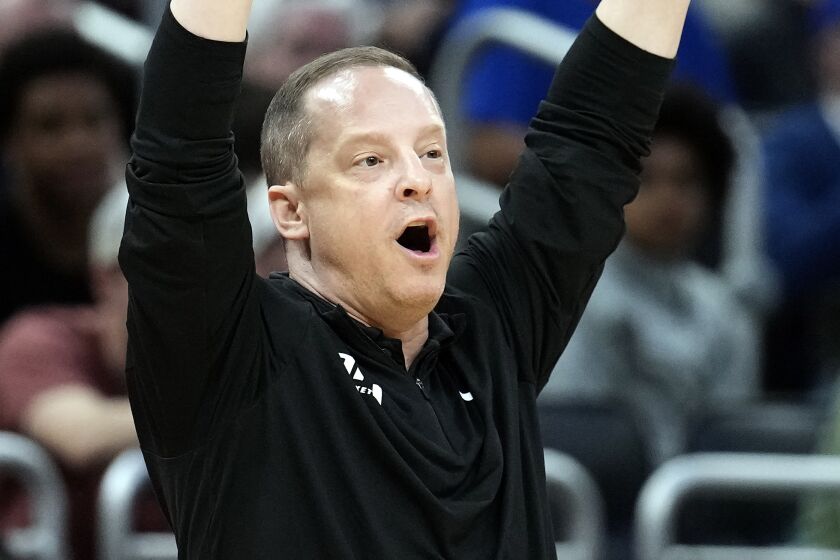 Oral Roberts head coach Paul Mills calls a play against Duke during the first half of a first-round college basketball game in the NCAA Tournament Thursday, March 16, 2023, in Orlando, Fla. (AP Photo/Chris O'Meara)