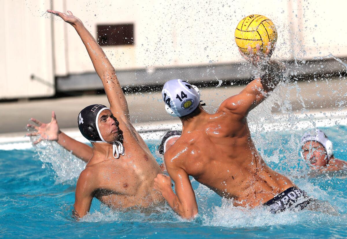 Newport Harbor's Conner Ohl (14) pulls up and takes a shot on goal as Christian Hammonds defends during Wednesday's match.