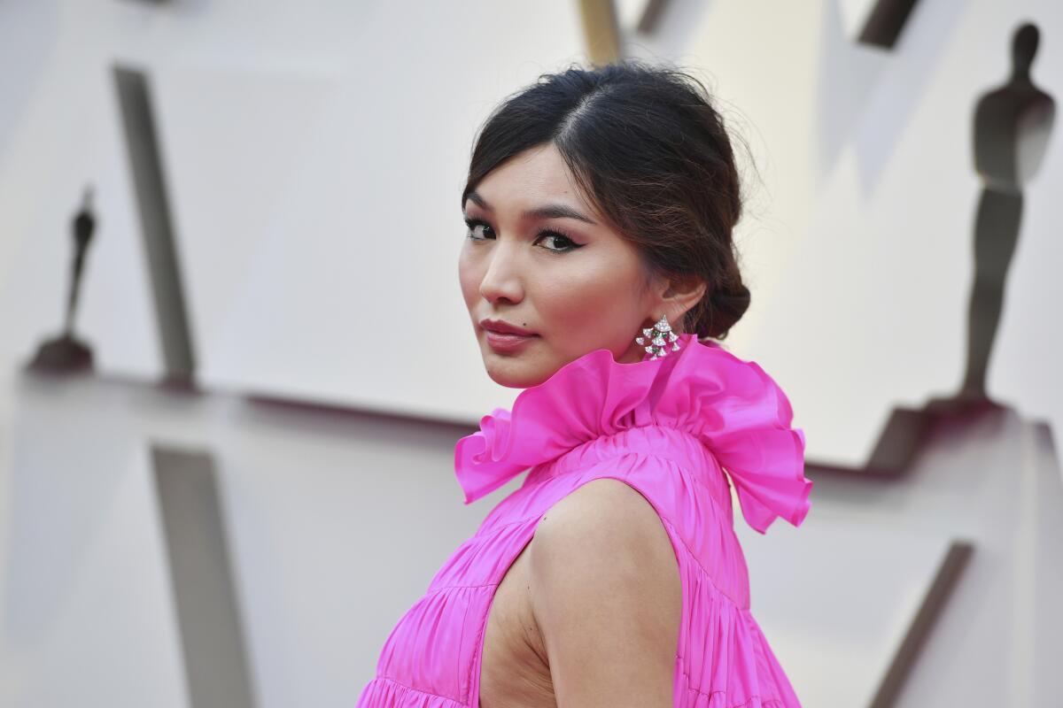 Gemma Chan Rein a ruffled pink dress