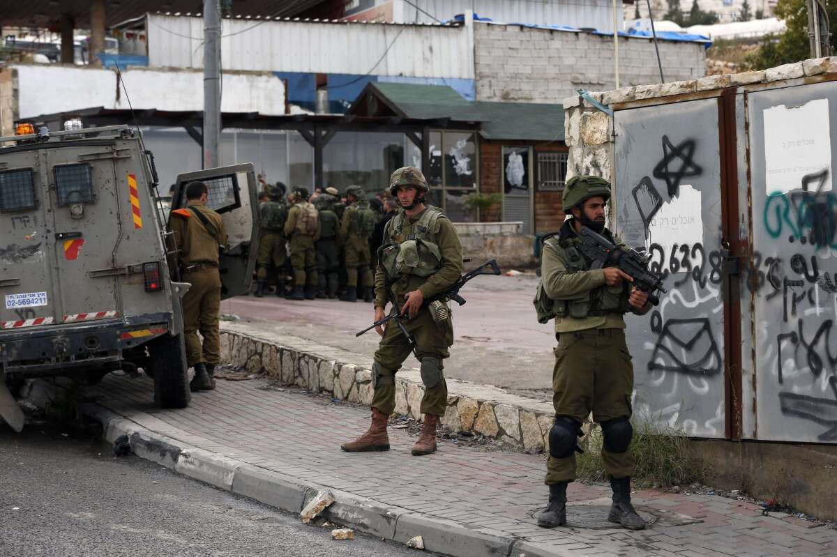 Israeli security forces in the West Bank village of Hizma.
