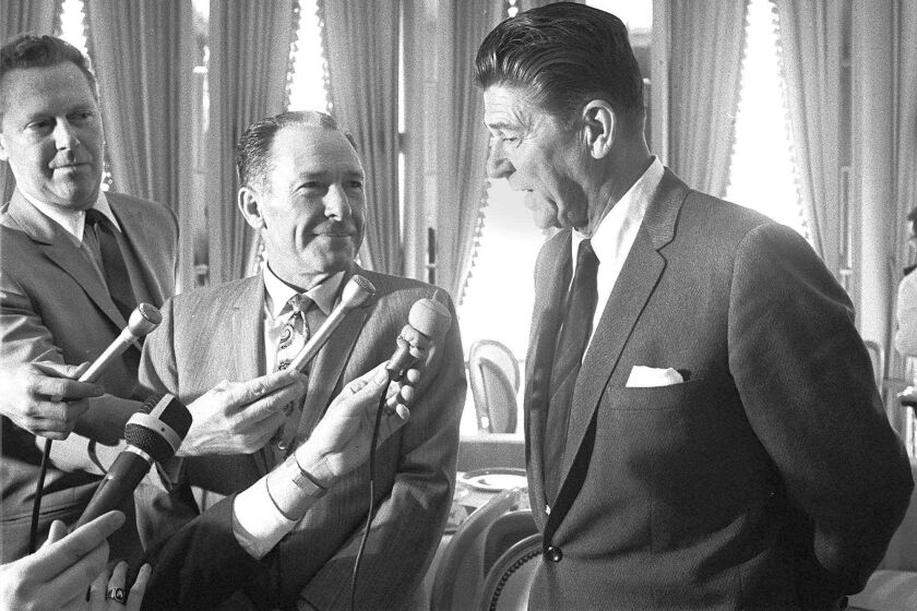 Backlash from the Watts riots helped reelect Los Angeles Mayor Sam Yorty, left, and aided Ronald Reagan in defeating Gov. Pat Brown.
