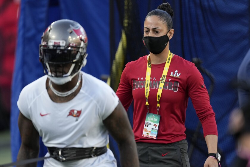 Tampa Bay Buccaneers strength and conditioning coach Maral Javadifar on the field before the NFL Super Bowl 55 football game between the Kansas City Chiefs and Buccaneers, Sunday, Feb. 7, 2021, in Tampa, Fla. (AP Photo/Chris O'Meara)
