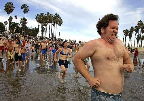 For 56 years, members of the Polar Bear Club have made an annual ritual of dipping into chilly ocean waters. This New Year's Day was no different, as club members skittered into the sea at Cabrillo Beach in San Pedro. It wasn't a race, and participants didn't even have to swim; all they had to do was get soaked.