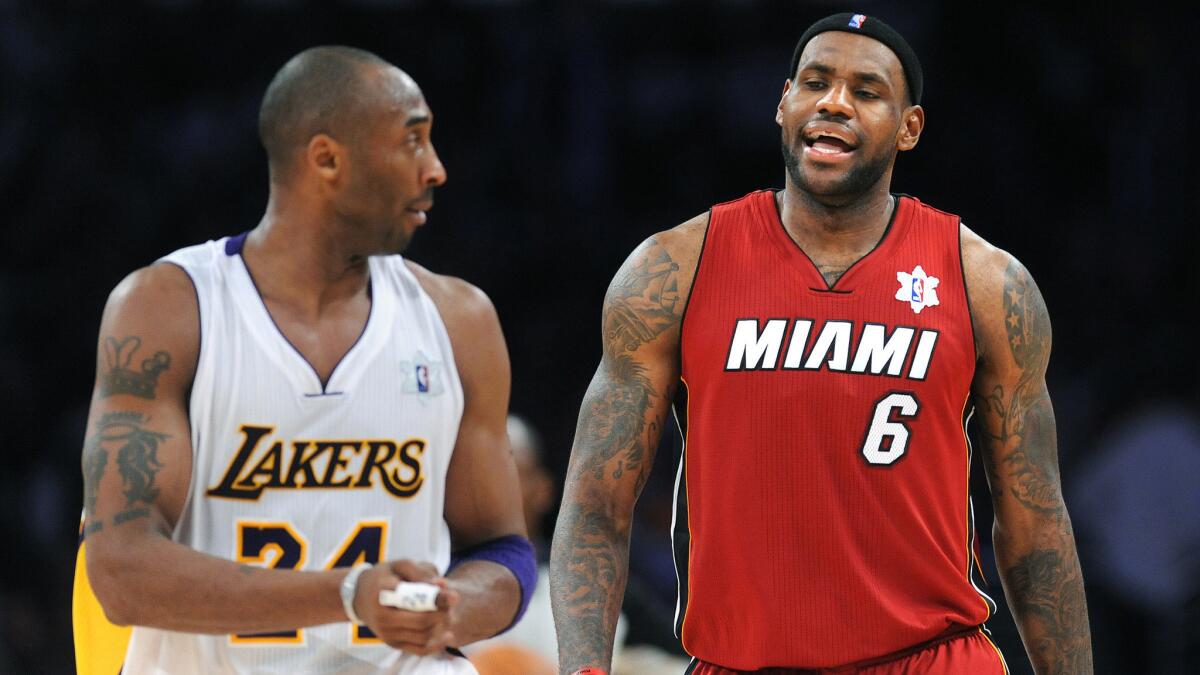Kobe Bryant, left, exchanges words with LeBron James during a Christmas Day game in 2010.