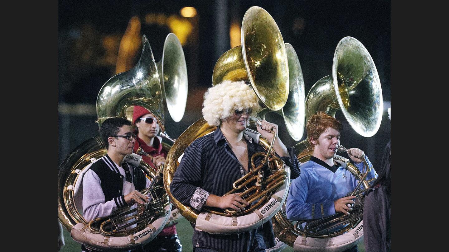 Photo Gallery: Crescenta Valley vs. Glendale in Pacific League football and the Crescenta Valley marching band takes the field in Halloween costumes