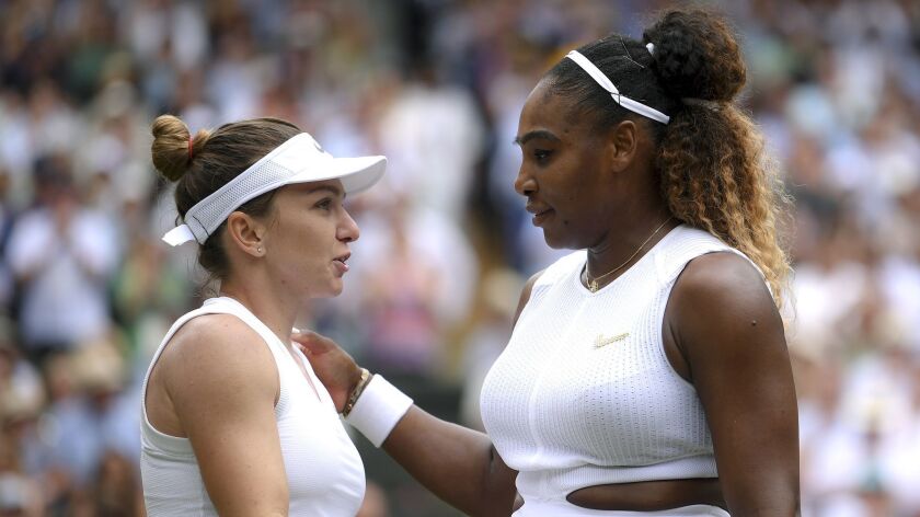 Simona Halep hugs Serena Williams after defeating her in the women's singles final at Wimbledon on Saturday in London.