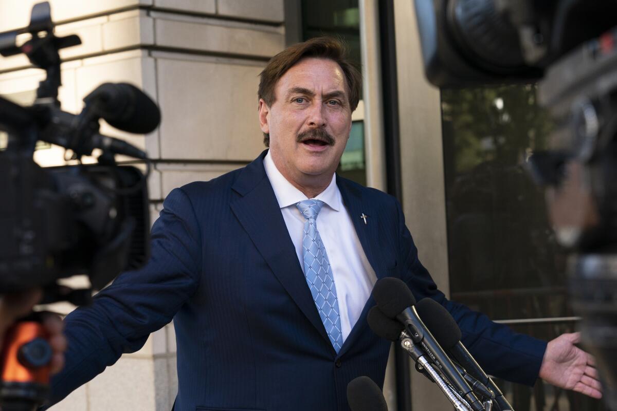 MyPillow chief executive Mike Lindell speaks to reporters outside federal court in Washington in June.