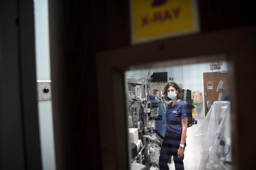 Dr. Jamie Taylor stands in a room that was converted into an area for COVID patients at Los Angeles Surge Hospital 