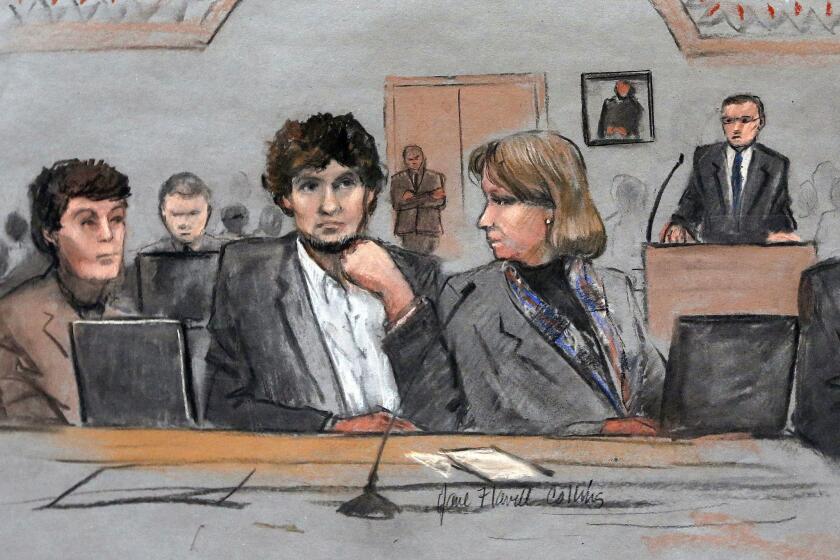 Dzhokhar Tsarnaev is depicted between defense attorneys Miriam Conrad, left, and Judy Clarke during his trial in Boston.