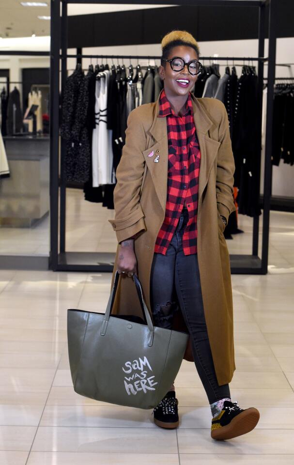 Who: Sam Smith, 34, Owings Mills resident, wardrobe stylist/event stylist Spotted at: Wardrobe Wednesday Sip & Shop fashion event featuring the black tie & sneaker ideas for The Be. Org. upcoming Sneaker Ball What she wore: LTD Creations black and red plaid flannel shirt from The Spice Suite in Washington, DC; E.L. black distressed skinny jeans from Marshalls; PUMA black sneakers with Melody Ehsani black and white shoelaces; Warby Parker glasses; stacked bracelets from her own line, New Vintage by Sam; and sage tote from Target that she painted with “Sam was here.” Her fashion philosophy & favorite fashion fixation: “Just to have fun and keep it light. Keep it simple and practical for my life. Cool sneakers. I love cool sneakers. I love heels to look at. But, I’m a girl on the go, so….”