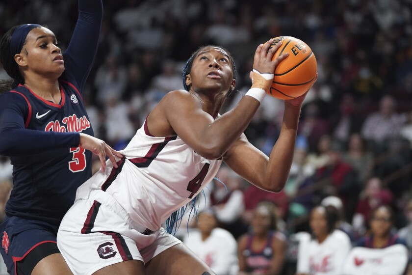 South Carolina forward Aliyah Boston (4) shoots against Mississippi guard Donnetta Johnson (3) during the first half of an NCAA college basketball game Thursday, Jan. 27, 2022, in Columbia, S.C. (AP Photo/Sean Rayford)