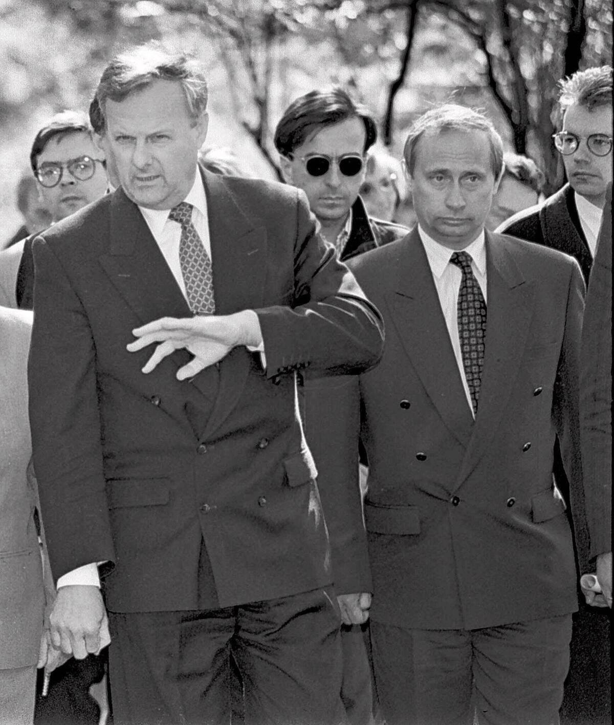 In 1994, Anatoly Sobchak, then mayor of St. Petersburg, stands with Vladimir Putin, his deputy mayor. Sobchak's daughter is running against Putin in Sunday's election.