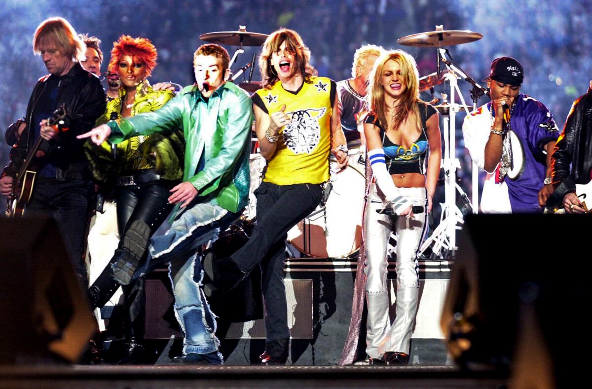 A half-dozen male and female musical stars perform in the 2001 Super Bowl halftime show
