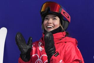 China's Eileen Gu reacts during the women's slopestyle finals at the 2022 Winter Olympics, Tuesday, Feb. 15, 2022, in Zhangjiakou, China. (AP Photo/Lee Jin-man)