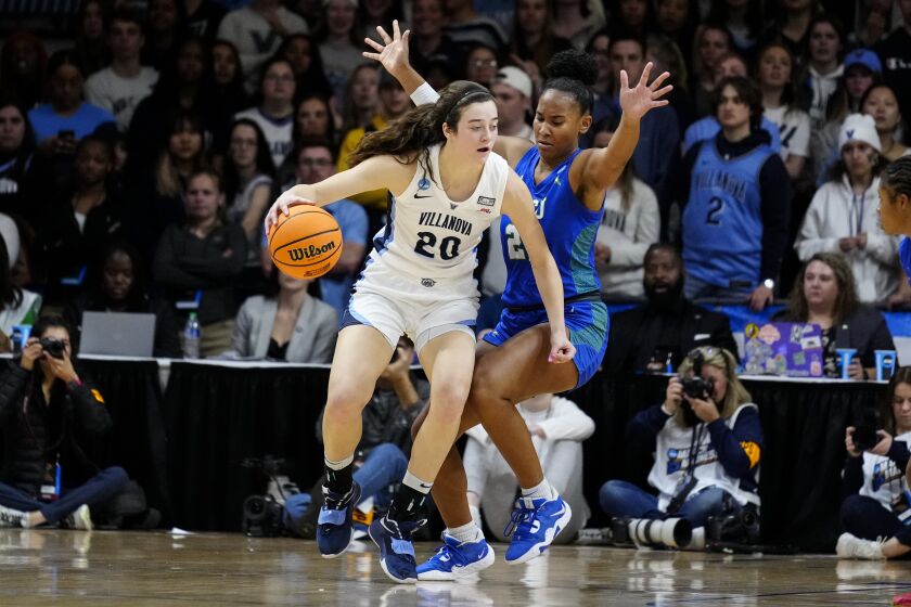 Villanova's Maddy Siegrist, left, drives to the net against Florida Gulf Coast's Kierra Adams during the first half of a second-round college basketball game in the NCAA Tournament, Monday, March 20, 2023, in Villanova, Pa. (AP Photo/Matt Rourke)