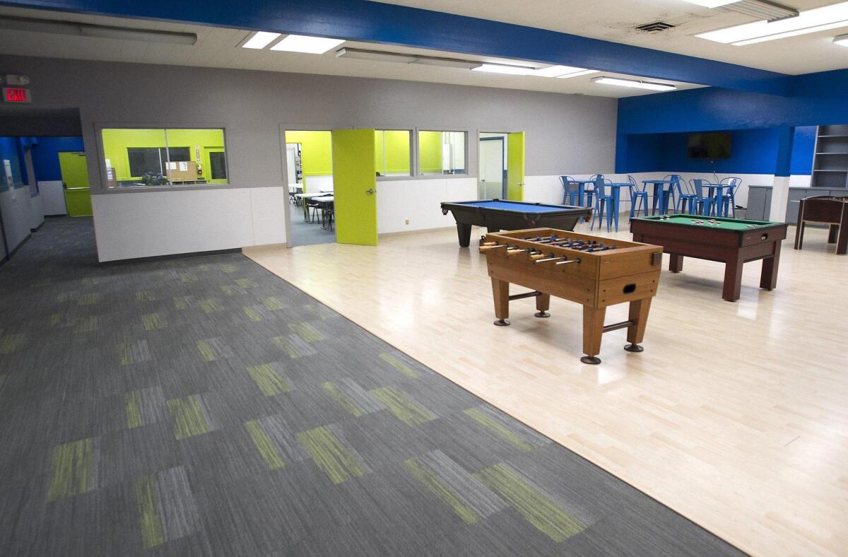 The entryway, carpet, paint, and game tables at the newly refurbished clubhouse at the Lou Yantorn Branch of the girls and boys club in Costa Mesa.