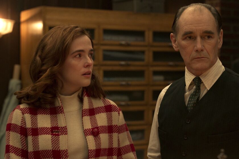 Zoey Deutch and Mark Rylance in “The Outfit”