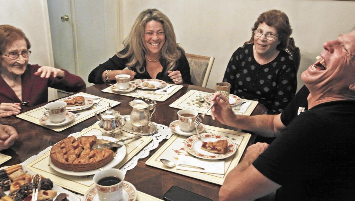 From left, Ludmila Page, 95, shares memories about the Holocaust with Mona Shafer Edwards, Marie Knecht (Page's daughter) and Martin Shafer during a meeting of their "kindergarten coffee" club at Page's Beverly Hills home on Oct. 28, 2015.