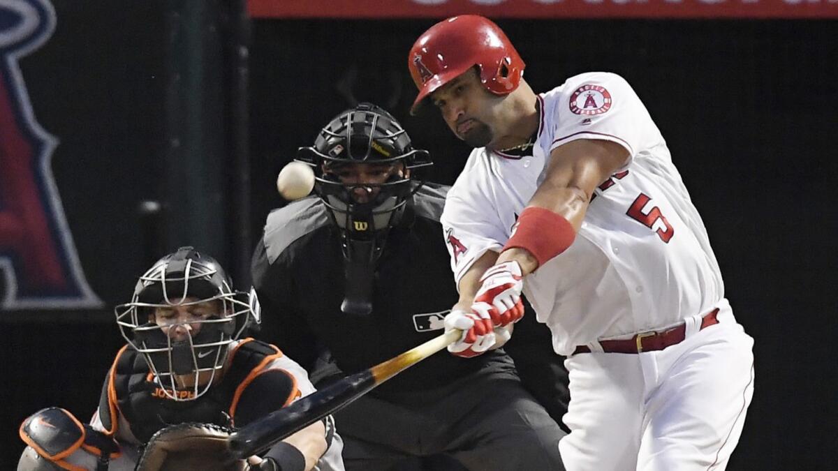 The Angels' Albert Pujols hits a solo home run on May 2.