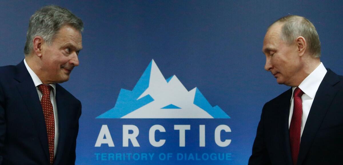 Russian President Vladimir Putin meets with Finnish President Sauli Niinisto during the International Arctic Forum in Arkhangelsk, Russia, on Thursday.