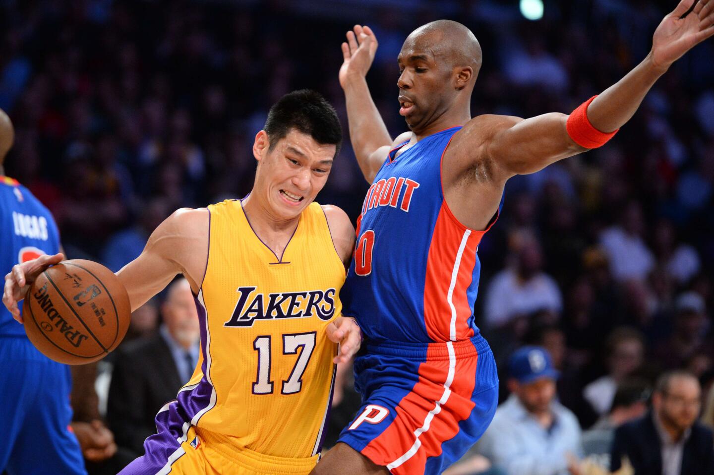 Jeremy Lin drives against Pistons guard Jodie Meeks during the first half of a game Tuesday at Staples Center.