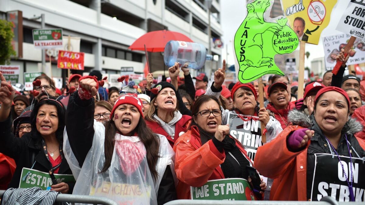 Striking teachers and supporters march on the charter school association offices in downtown Los Angeles on Jan. 15.