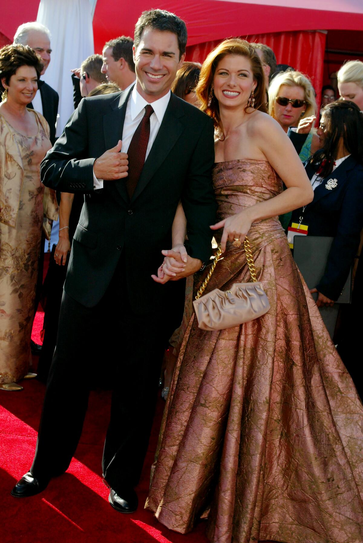 Actors Eric McCormack and Debra Messing on the 2003 Emmys red carpet.