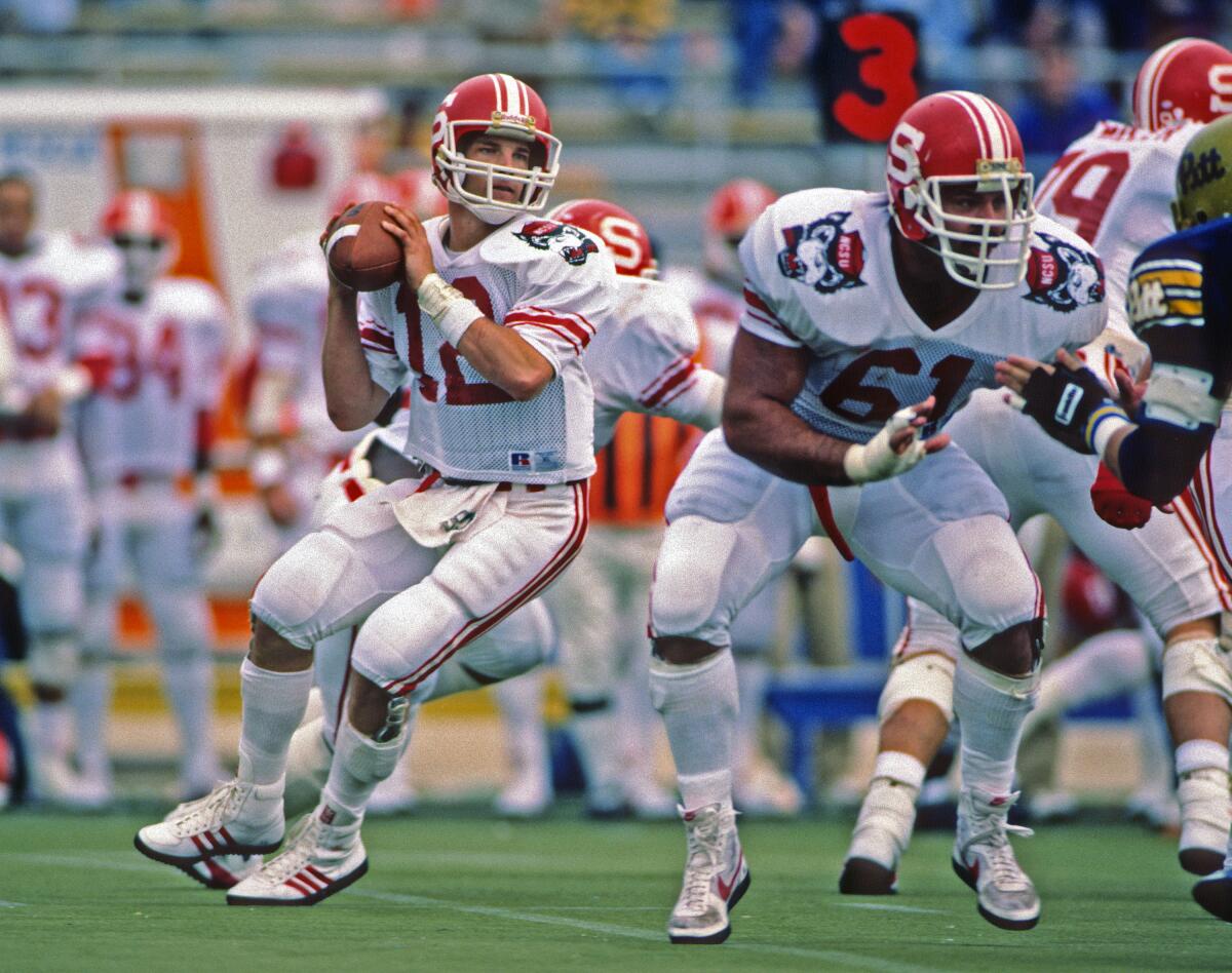 North Carolina State quarterback Erik Kramer passes during a game against Pittsburgh on Oct. 12, 1985.