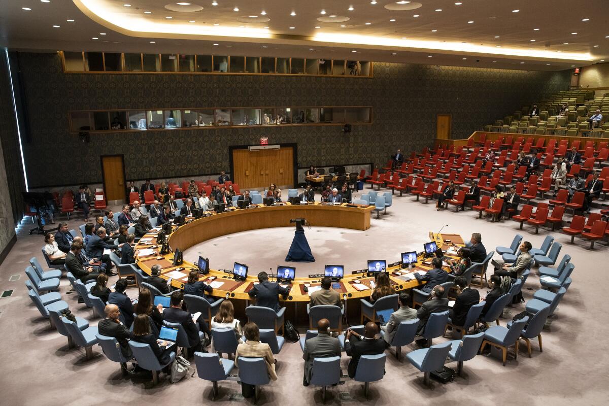 People in chairs in a nearly circular pattern