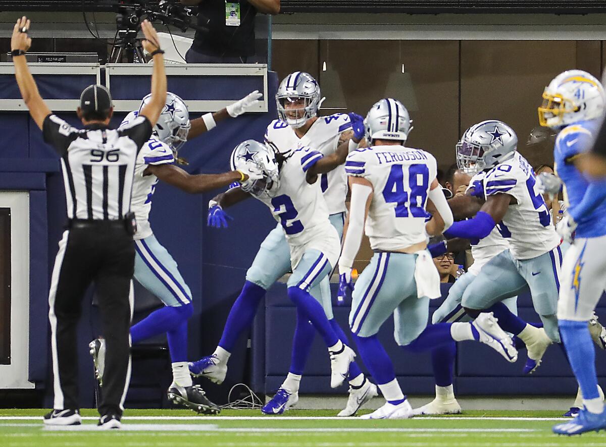 Cowboys players celebrate after a touchdown against the Chargers.