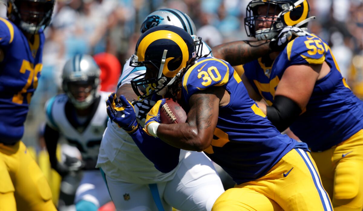 Todd Gurley of the Rams attacks the Carolina defense during one of his 14 carries. Despite rushing only five times for eight yards in the first half, Gurley finished with 97 yards for a 6.92 average.