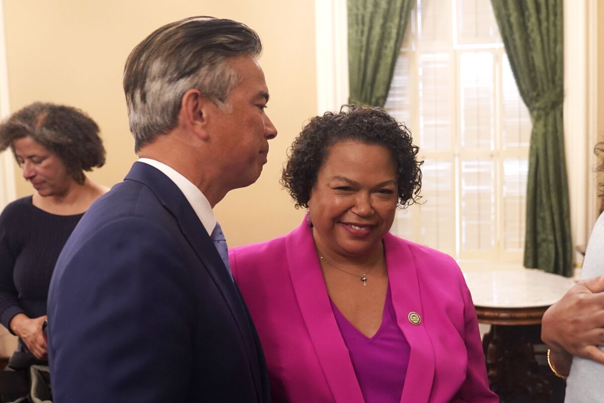 California Attorney General Rob Bonta, talks with his wife, Assemblywoman Mia Bonta, D-Oakland,