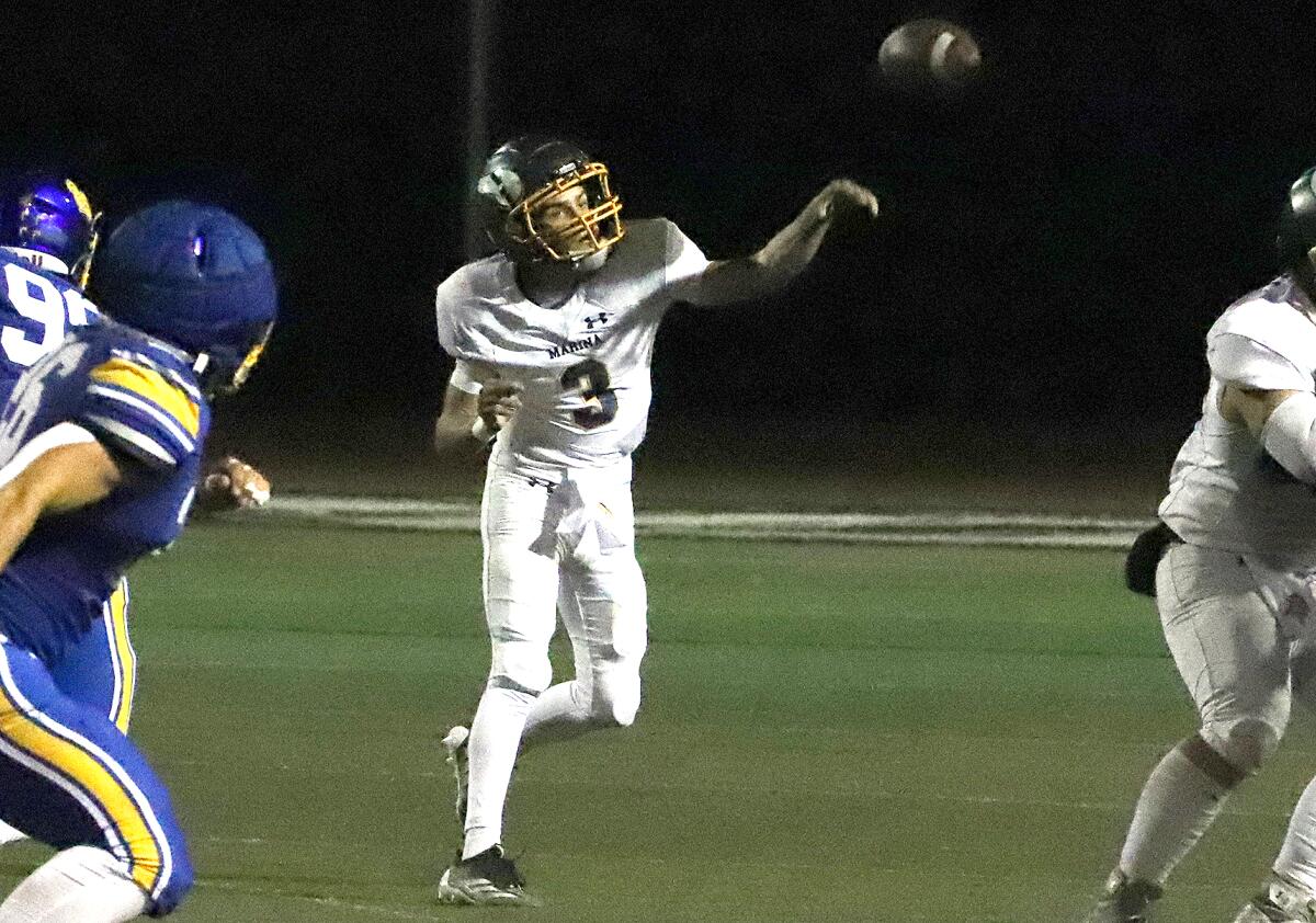 Marina quarterback Garrett Hunnicutt (3) throws a pass against Fountain Valley in a nonleague game at Westminster High.