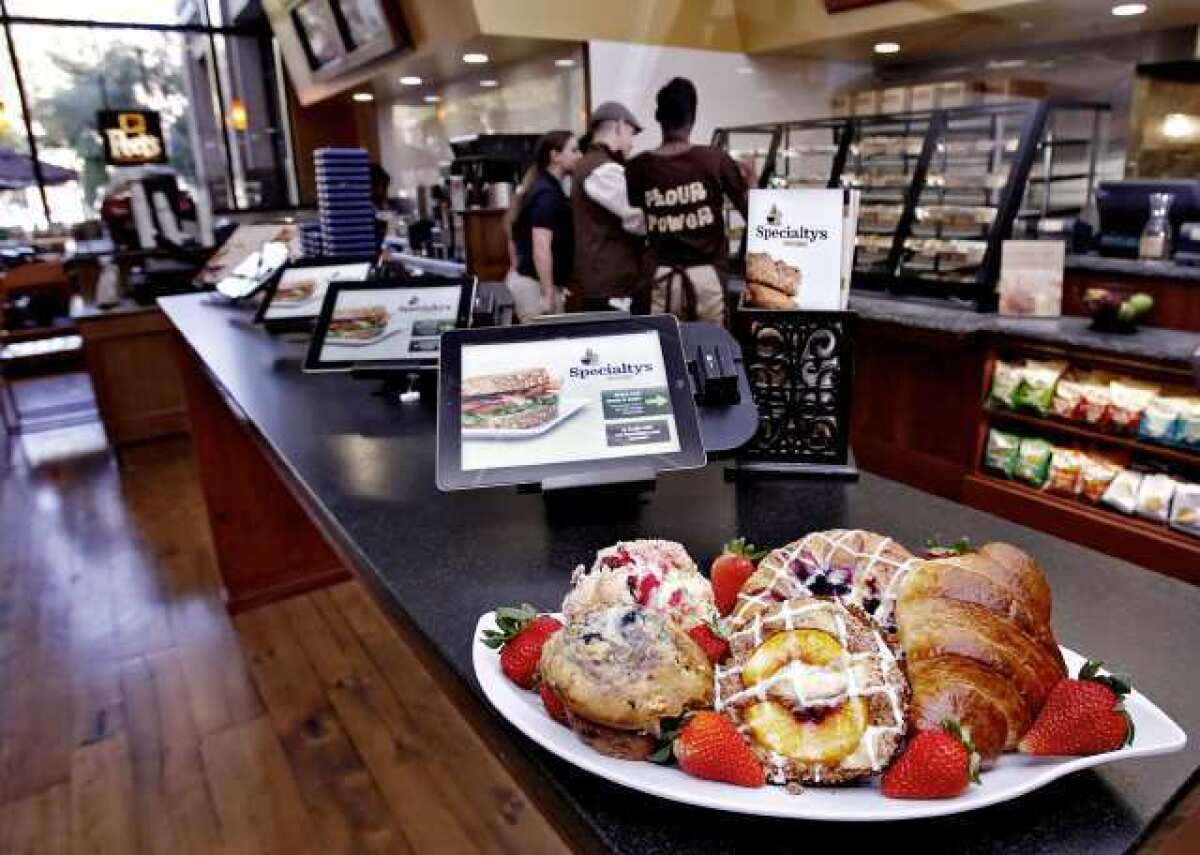 Selected 2 of 24 | Batch 1 of 17 Specialty's Cafe & Bakery gives the customer the option of ordering via iPads at the 520 N. Brand Blvd. location in Glendale. Above, from top left, clockwise: Cranberry scone, Blueberry cream cheese croissant, Butter croissant, Peach coffee cake and Blueberry muffin.