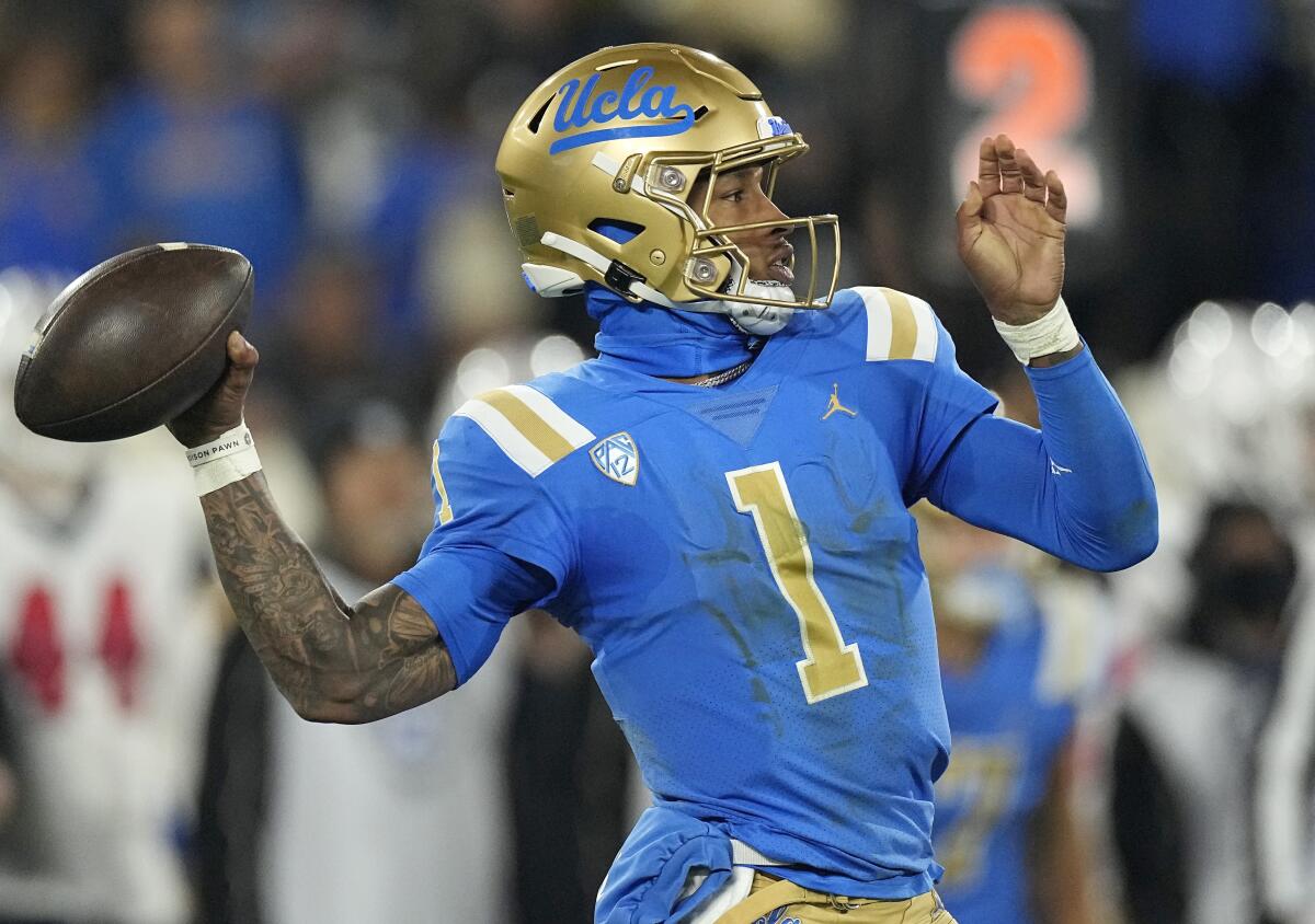 UCLA quarterback Dorian Thompson-Robinson passes during the first half of a game.