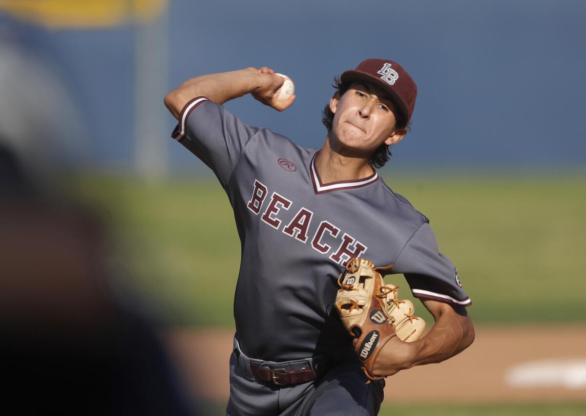 Laguna Beach pitcher Nick Bonn pitches out of a jam during Wave League opener against Newport Harbor.