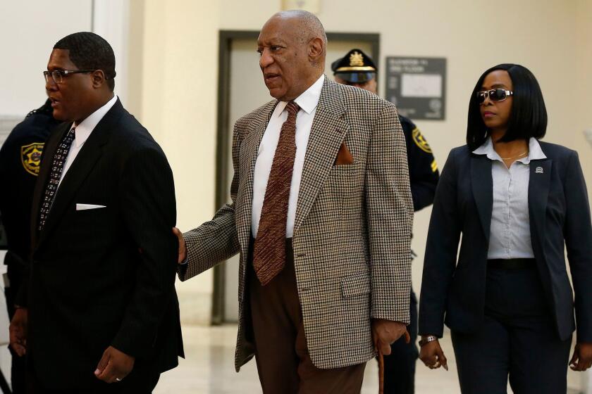 Bill Cosby, center, returns to court for a pretrial hearing in his sexual assault case at the Montgomery County Courthouse in Norristown, Pa., on Dec. 13.