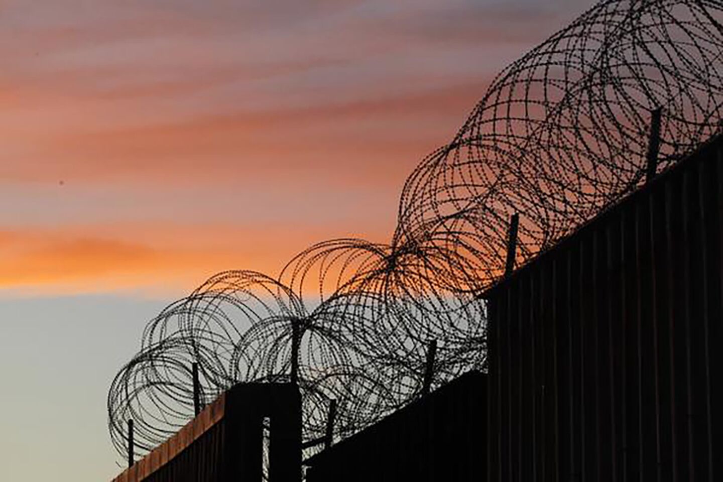 Razor wire tops most of the border wall that separates San Diego from Tijuana.