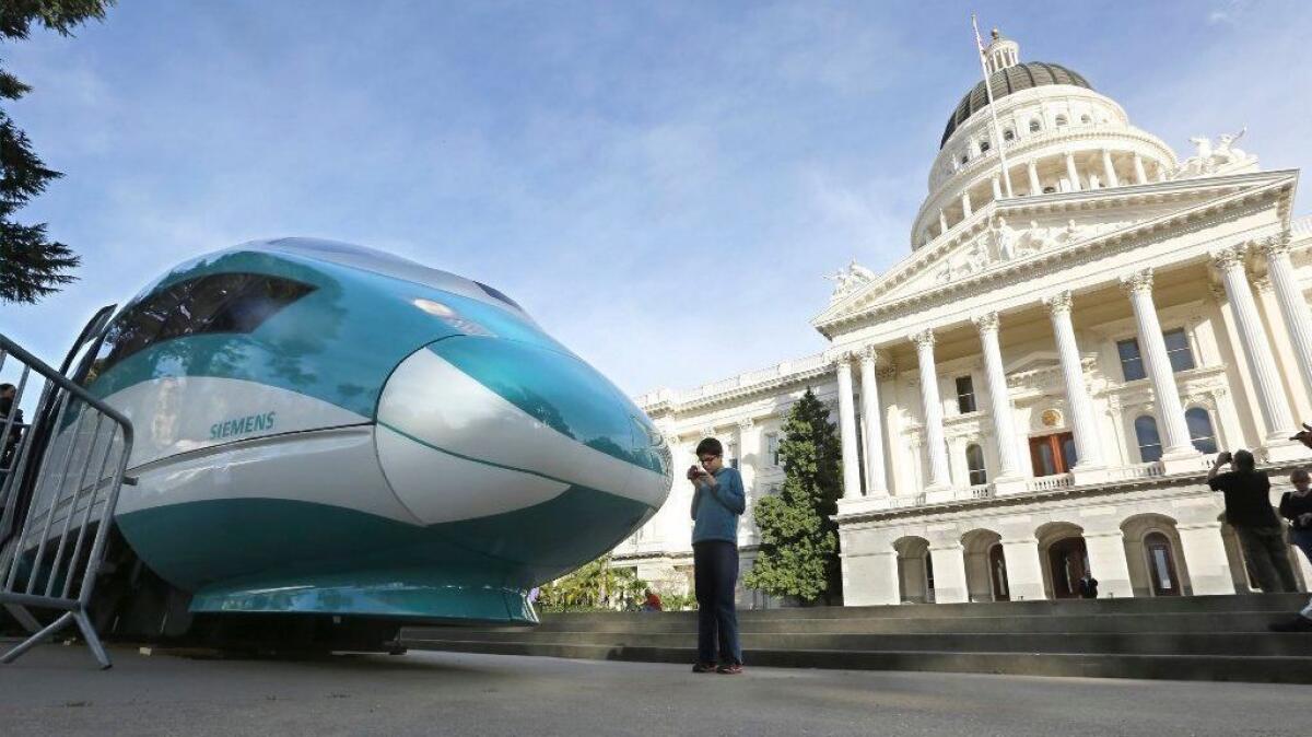 A full-scale mock-up of a high-speed rail locomotive sits in front of the state Capitol building in Sacramento on Feb. 26, 2015.