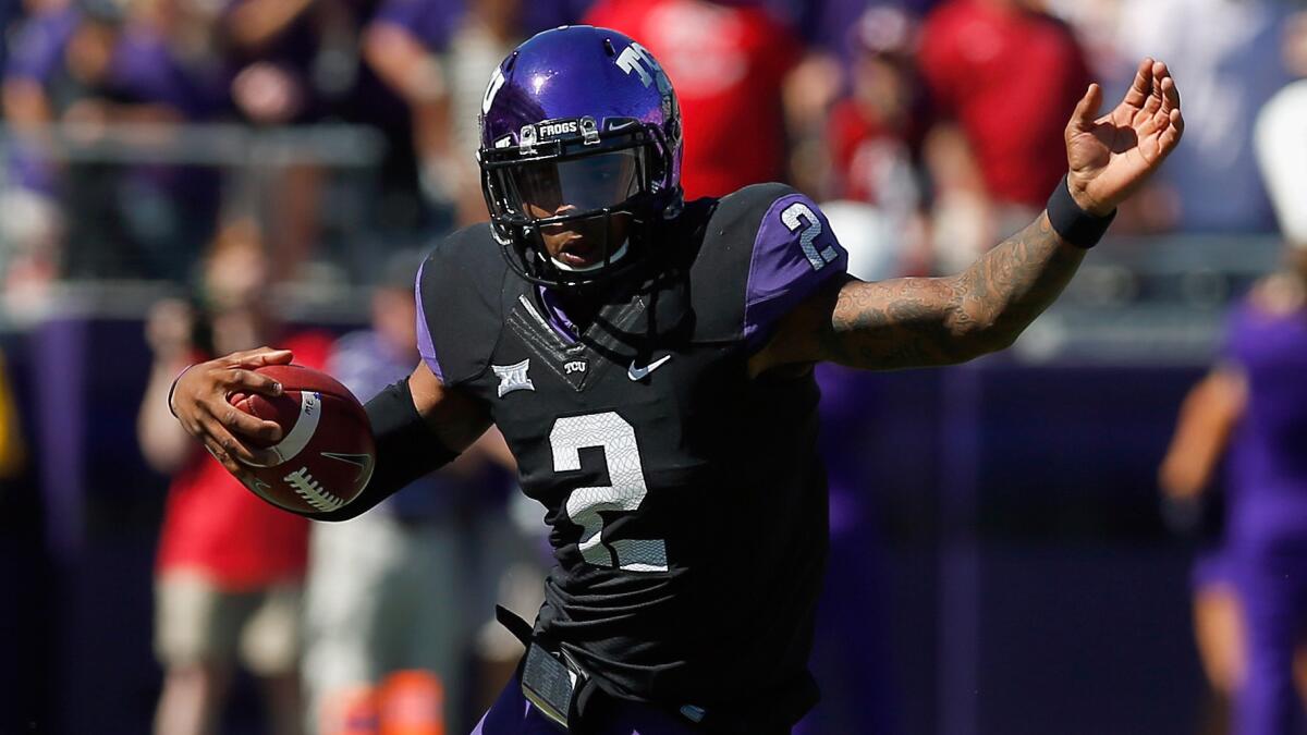 Texas Christian quarterback Trevone Boykin scrambles during the first half of the Horned Frogs' 37-33 upset victory over Oklahoma on Saturday.