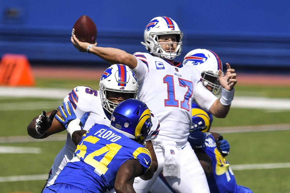 Buffalo Bills quarterback Josh Allen (17) throws under pressure by Rams' Leonard Floyd in 2018.