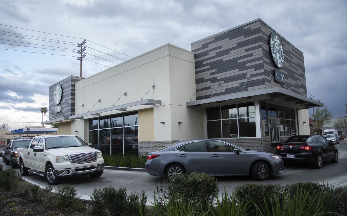 Cars lined up in the drive-through lane at a Starbucks in Chatsworth. 