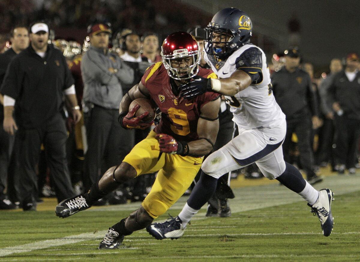 USC receiver JuJu Smith is tackled by California defensive end Noah Westerfield after making an eight-yard catch against the Golden Bears on Nov. 13.