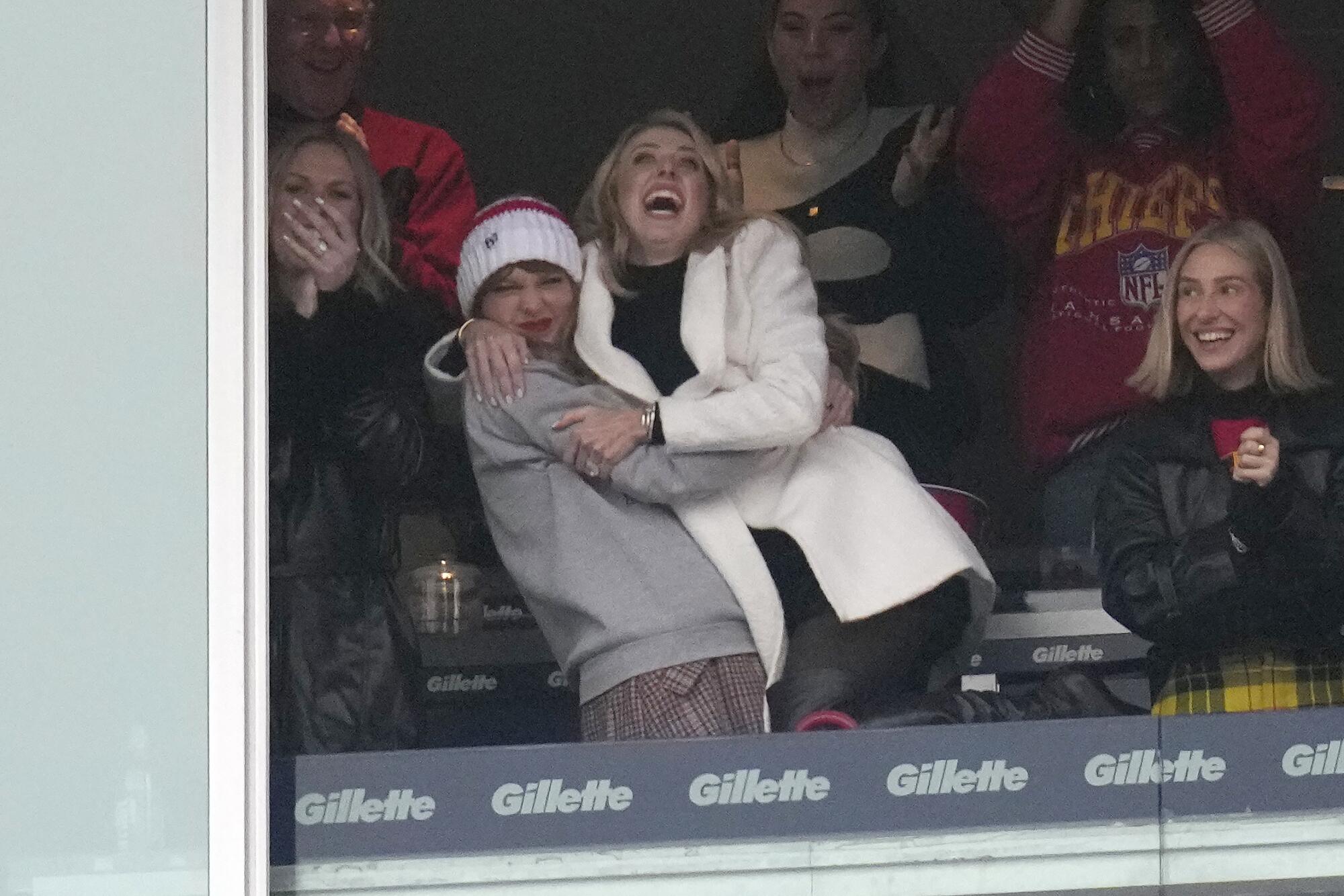 Taylor Swift, Brittany Mahomes, and Ashley Avignone celebrate after the Chief's touchdown against the Patriots in December.