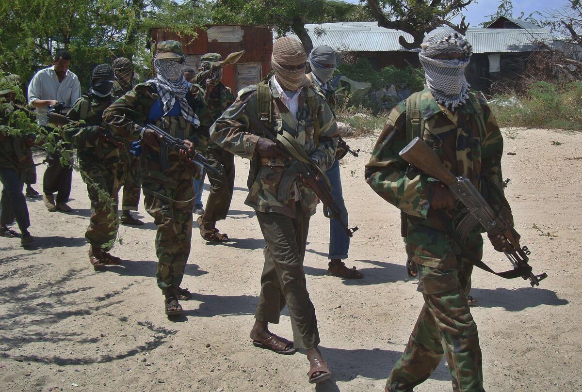 Shabab militia recruits walk down a street in the Somali capital, Mogadishu, in 2012. A senior Shabab leader was killed in a U.S. airstrike, according to U.S. and Somali officials.