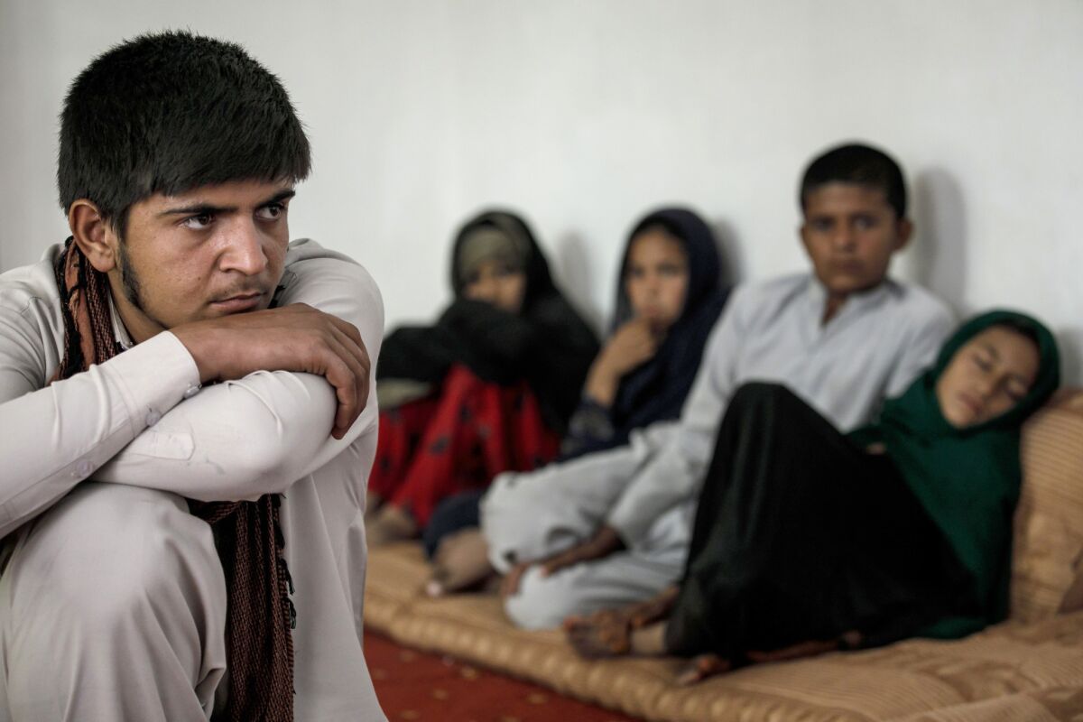 From left, Lal Mohammad, 17, Roqia Khan, 10, Basina Khan, 9, Nasir Mohammad, 13, and Rishma Khan, 8, lost their father in the August bombing. U.S. officials say the deadly blast was caused by a roadside bomb, not an airstrike.
